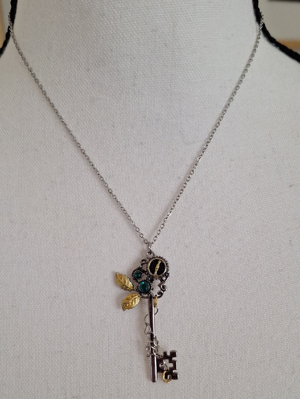 Vintage-Inspired Silver Key Pendant Necklace with Gold Leaf and Teal Accents